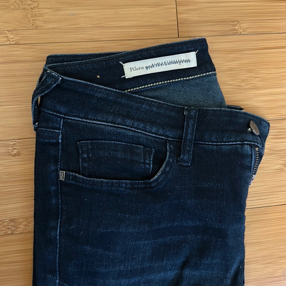 Pilcro/Anthropologie dark wash stretch jeans.